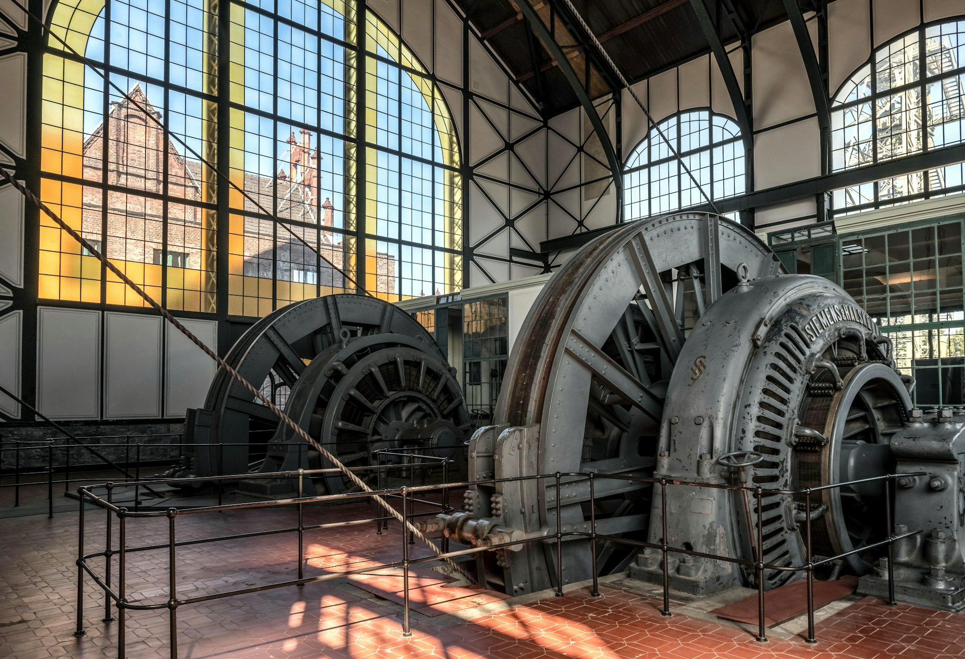 a large metal machine sitting inside of a building